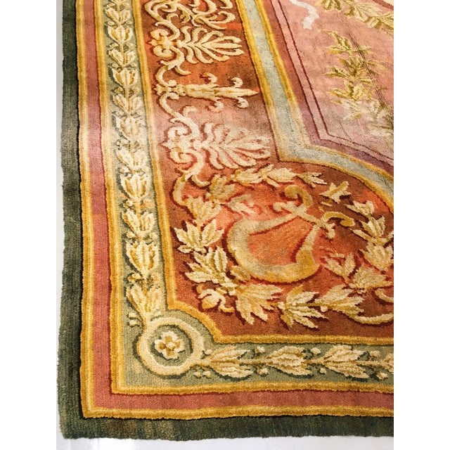 This exquisite oversized Spanish Savonnerie rug from the 1920s is a masterclass in aristocratic elegance and refined...