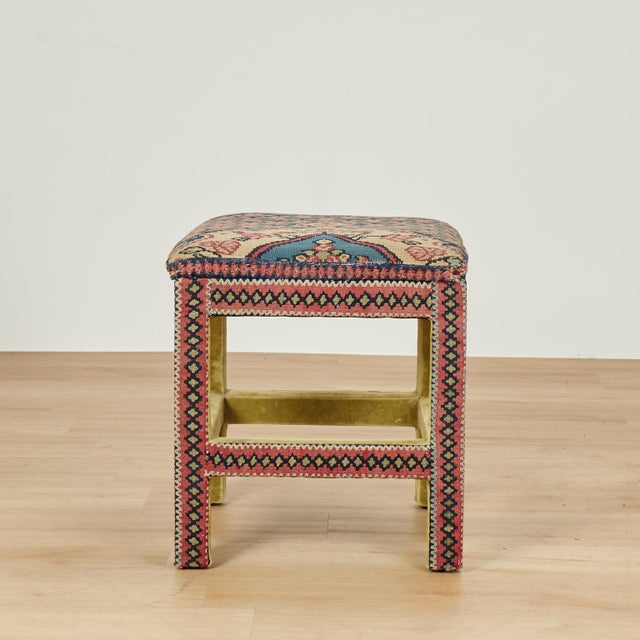 Chic pair of highly decorative square stools, crafted in hardwood in classic form, and upholstered in an antique Persian...