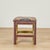Chic pair of highly decorative square stools, crafted in hardwood in classic form, and upholstered in an antique Persian...