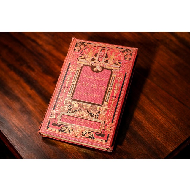 This exquisite 1885 edition of Les Jeux de la Jeunesse (The Games of Youth) is a truly remarkable example of Victorian-era...