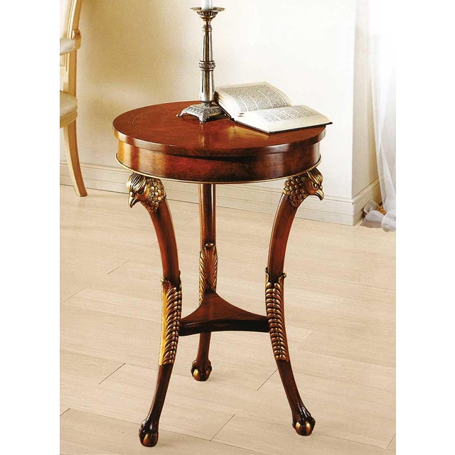 Handcrafted in Italy from olive ash burl, this small Empire table features three carved falcon heads with antique 24-karat...