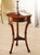 Handcrafted in Italy from olive ash burl, this small Empire table features three carved falcon heads with antique 24-karat...
