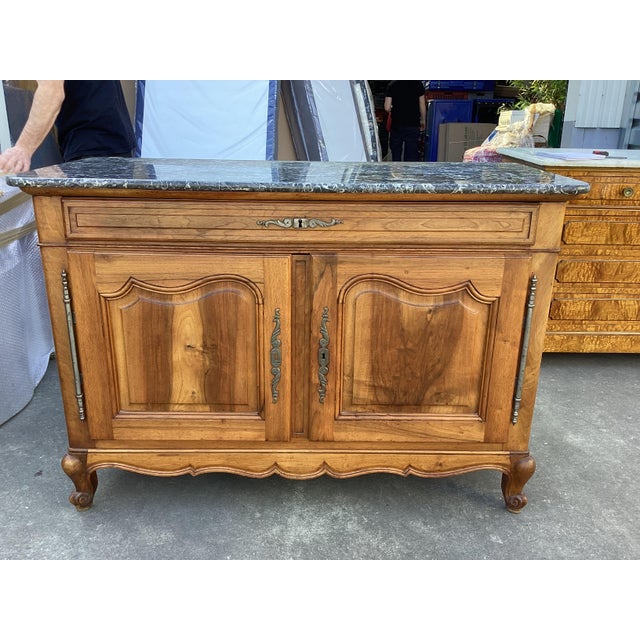 Lovely French antique Credenza. Made of solid cherry wood, this piece feature a top drawer and 2 lower doors where there...
