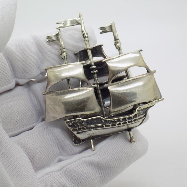 An elegant vintage miniature depicting a sailing ship, handcrafted in Arezzo (Tuscany) between the 1980s and 1990s in...