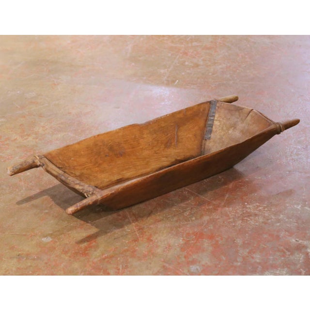 This authentic antique French dough bowl was hand-carved in France circa 1880 from a single solid block of elm, a wood...