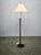 Striking adjustable floor lamp produced in germany during the 1970s, featuring an elegant combination of oak wood, metal...
