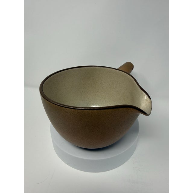 Designed by Edith Heath for Heath Ceramics, this vintage No. 110 Pouring Bowl is a wonderful example of California modern...