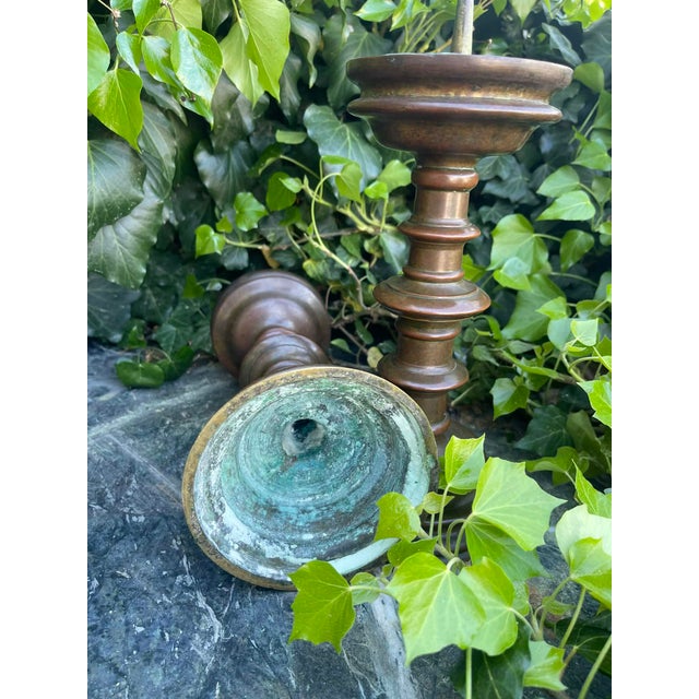 A Pair of Bronze Pricket Candlesticks Circa 1500 A PAIR OF BRONZE PRICKET CANDLESTICKS SOUTH GERMAN, CIRCA 1500 Each with...