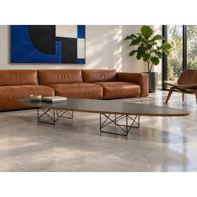 Iconic Mid Century Modern Charles and Ray Eames surfboard coffee table for Herman Miller, featuring an elongated...