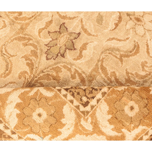 An early 20th century Indian Amritsar carpet, the sand field with an overall design of enlarged medallions shaped by...