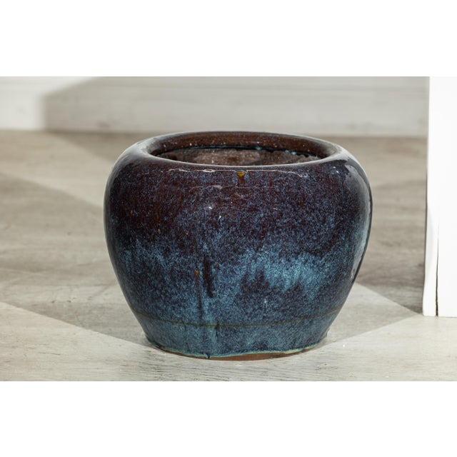 "About the Item This very near pair of vintage ceramic planters from China is characterized by their rounded, slightly...