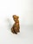 Decorative French ceramic dog sculpture dating from the 1970s. The seated dog is depicted with a stylized, expressive...