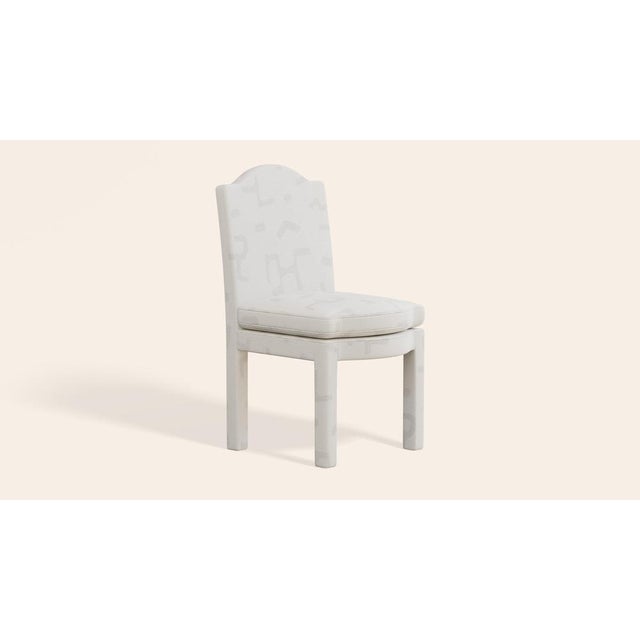 Our fully upholstered dining chair is a super chic addition to any dining table and can also serve as a side or occasional...