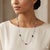 18k Necklace with 3 pink sapphires weighing 4.01 carats and 5 blue sapphires weighing 6.28 carats and 12 diamonds weighing...
