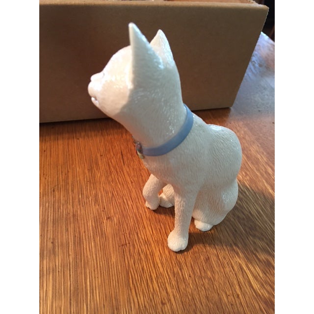 Sweet white kitty cat with a blue collar that has a butterfly on it. This figurine is made by Lenox and is called Sweet...