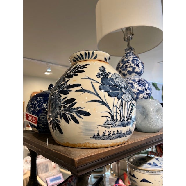 The Blue & White Stoneware Ginger Jar Add the Hand-Painted Stoneware Vintage Reproduction Ginger Jar with Floral Pattern...