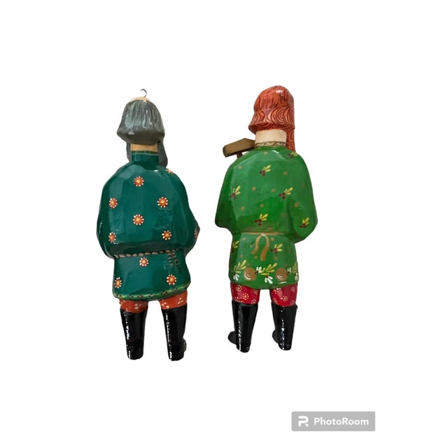 This pair of ornaments hails from Europe somewhere:) Two men, one with an accordion and one with a woodworking tool…maybe...