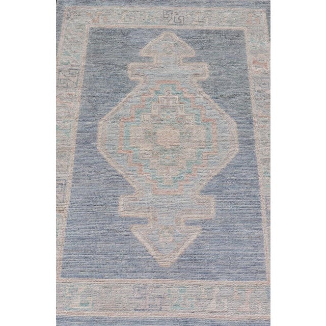 Early 21st Century Medallion Designed Modern Oushak With Blue Background and Cream Border 2'7 X 3'11 For Sale - Image 5 of 9