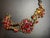 Gold 1950s Bohemian (Czech) Panel Link Bracelet Large Faceted Oval Ruby Glass Stone, Surrounded by Quatrefoil-Arranged Floral Clusters. For Sale - Image 8 of 8