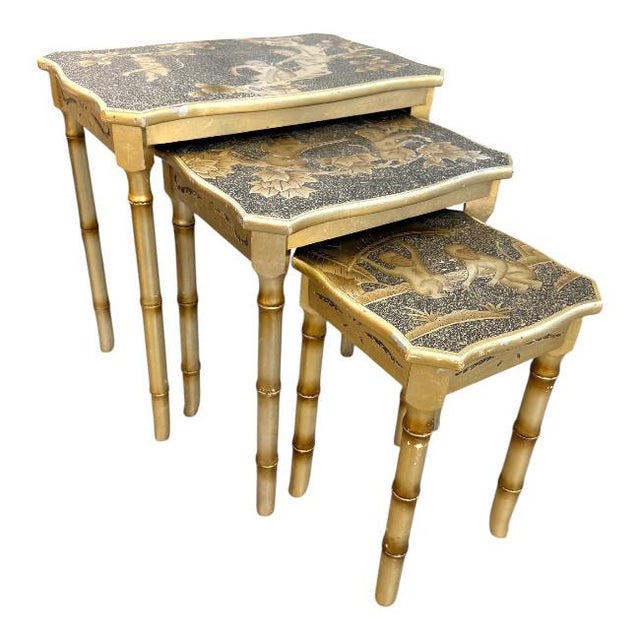 Charming vintage faux bamboo nesting tables featuring hand-decorated tops with playful monkey and tropical motifs. Crafted...