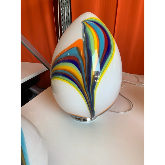 White egg lamp in Murano glass with multicolored reeds fused together. Glass rods create spectacular and scenographic...