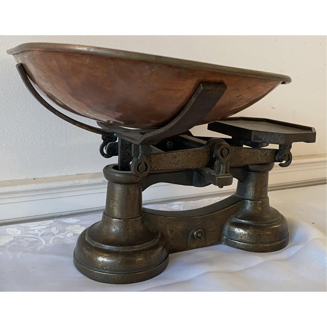 A 19th century heavy rectangular wrought iron balance scales with a fitted copper tray. Product Information: Materials:...