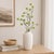 Add a touch of spring to your decor with the Snowball Floral Branch. Featuring soft green and brown tones with vibrant...