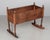 A 19th century French Country baby crib, hand crafted will planks of chestnut, with turned oak spindle legs and finials....