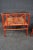 Pair McGuire Red Painted Bamboo and Caned Glasstop Side Tables, distressed red painted bamboo frame with two open sides...