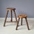This set of 2 French wooden tripod stools is in good condition. Originally milking stools. Bobbin legs. Sturdy....