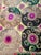 Hand-embroidered Suzani panel from Uzbekistan — large round medallions in tan, green and black with magenta centres on a...