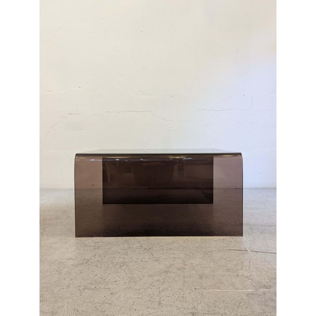 Square acrylic coffee table, 1970s 80x80x40 cm Smoky color Signs of wear in the form of scratches in the acrylic are present.