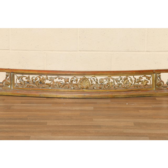 Bring timeless European elegance to your fireplace with this impressive 19th-century French bronze fireplace fender,...