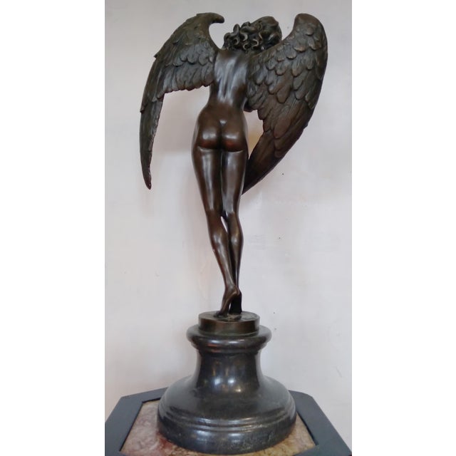 A striking Art Deco–style bronze sculpture of a winged nude female figure, conceived as an allegorical angel or...