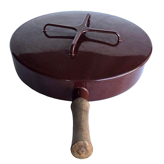 Offered is a chocolate and white porcelain enamel over stainless steel skillet pan from the Dansk Kobenstyle collection...