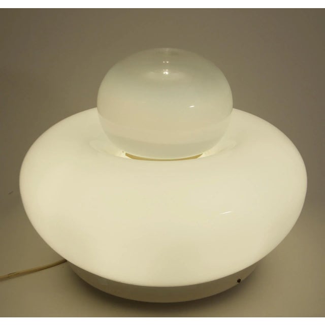 This table lamp was designed by Giuliana Gramigna and was produced by Artemide in Italy in 1968. It features a large round...
