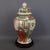 A stunning vintage potiche vase in decorative porcelain of oriental inspiration, original and marked on the base. Subject...