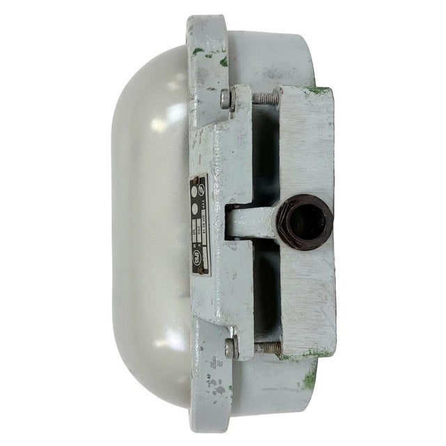 This Industrial wall light was made by Elektrosvit in former Czechoslovakia during the 1970s. It features a cast aluminium...