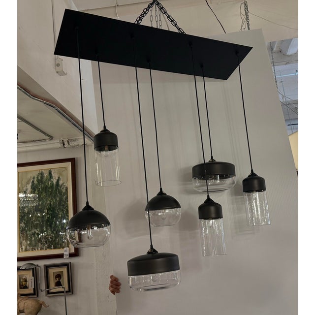 Design Plus Gallery presents a Customized Parallel Collection Chandelier from Hennepin Made. The. light fixture is a...
