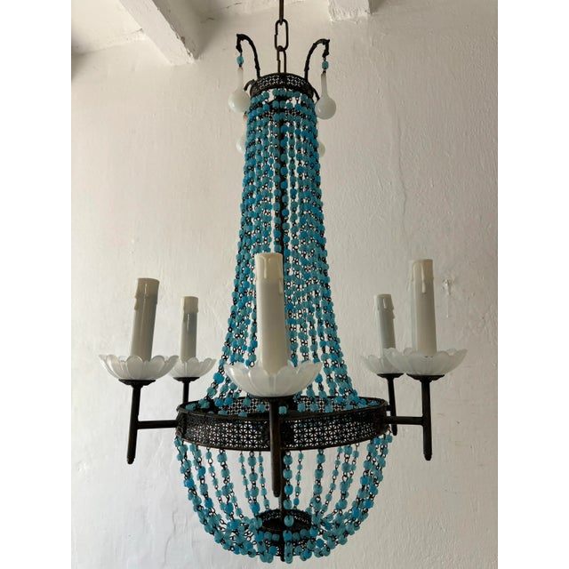 Housing 6 lights, sitting in white opaline bobéches. Will be rewired with certified UL US sockets for the USA and...