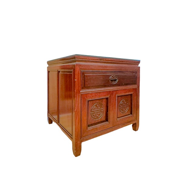 A beautifully crafted vintage rosewood end table inspired by traditional Ming Dynasty design. It features a single drawer...