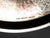 Silver, chased. A wide, rounded foot with a slightly fluted base ring. A disc-shaped knop with chased, subtle, fruit-like...