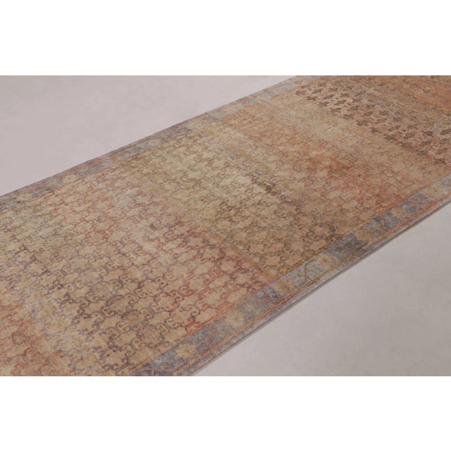 This magnificent 4x13 runner rug, hand-knotted in wool and silk, from rug & Kilim’s Modern Classics Collection, is a...
