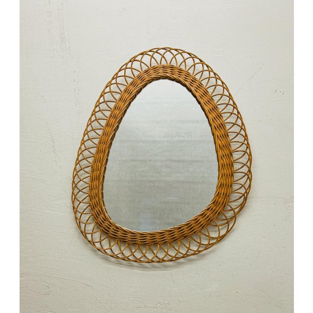 Charming old rattan mirror from the 50-60s in a special design of an asymmetrical teardrop. Very decorative handmade item...