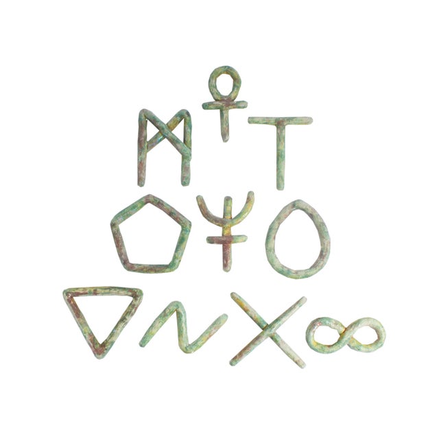 A 1991 set of ten ceramic wall sculptures by the American artist Ana England (born 1953). From England's "Essential...