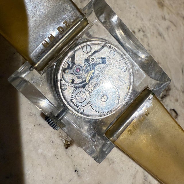 For your consideration, a vintage Sutton square acrylic lucite mechanical wrist watch. Swiss circa the 70's. Dimensions:...