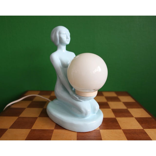 1970s Blue Ceramic Woman Table Lamp Holding a Glass Globe | Chairish