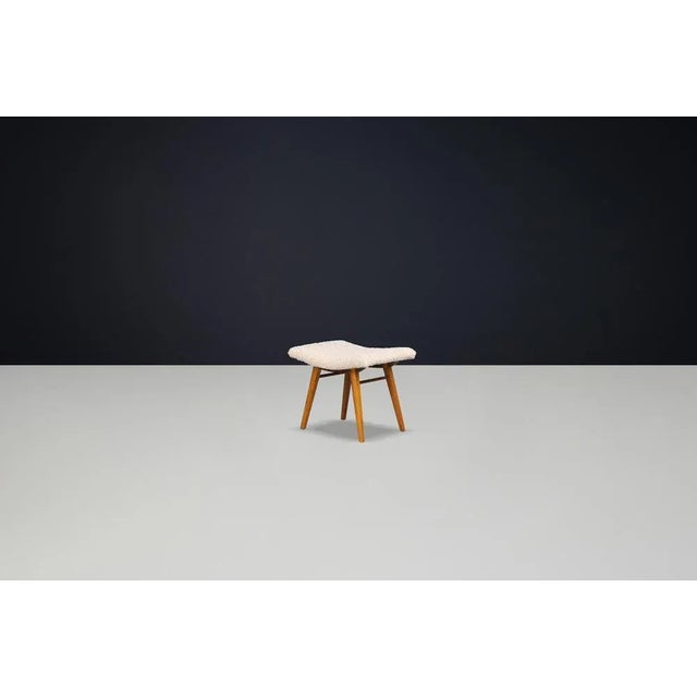 Mid-Century Modern Beechwood Stool with New Teddy Upholstery, Czechoslovakia, 1960s Embodying the playful minimalism of...