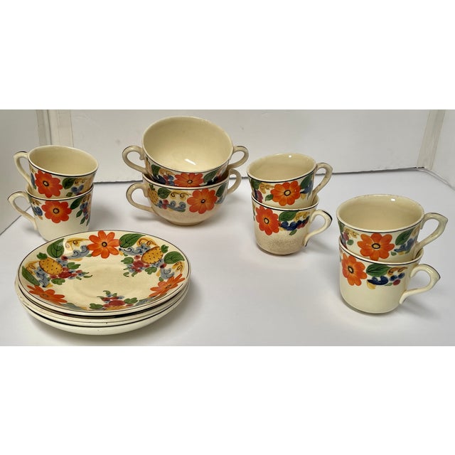 A collection of twelve charming “Maytime” pattern pieces with hand-painted flowers and pineapples that could be added to...