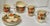 A collection of twelve charming “Maytime” pattern pieces with hand-painted flowers and pineapples that could be added to...